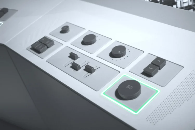 Tactile dials, sliders and buttons on the white Big Bang Data exhibition control panel.